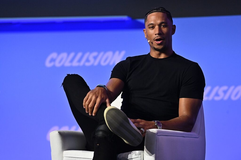 Josh Hart seated onstage at Collision in Toronto in June 2022