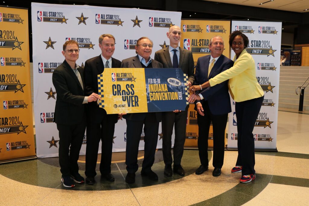 NBA commissioner Adam Silver, fourth from left, poses with Indianapolis officials holding an oversized ticket for NBA All-Star 2024