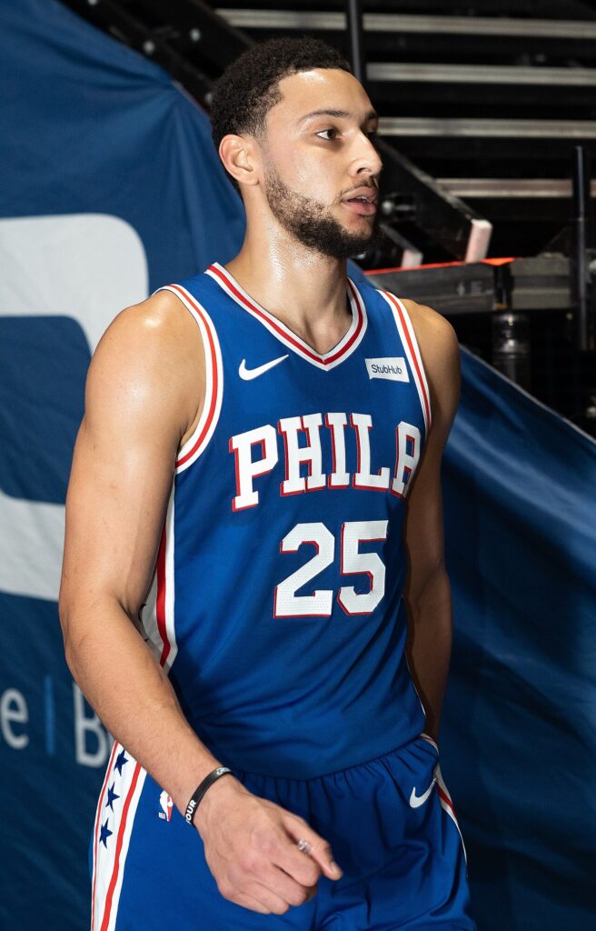 Ben Simmons in an NBA game, looking upcourt with the ball