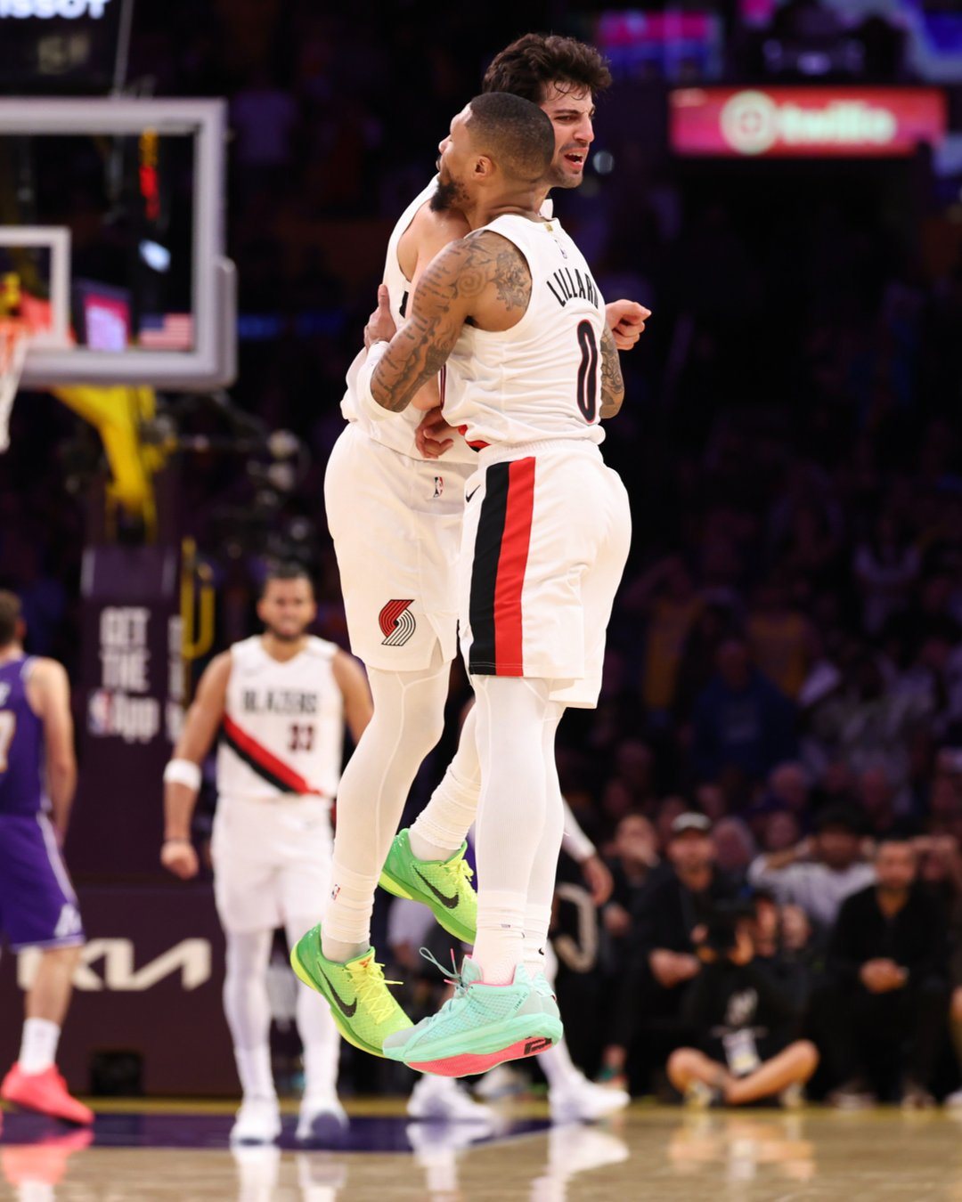 Trail Blazers players celebrate during the win over the Lakers