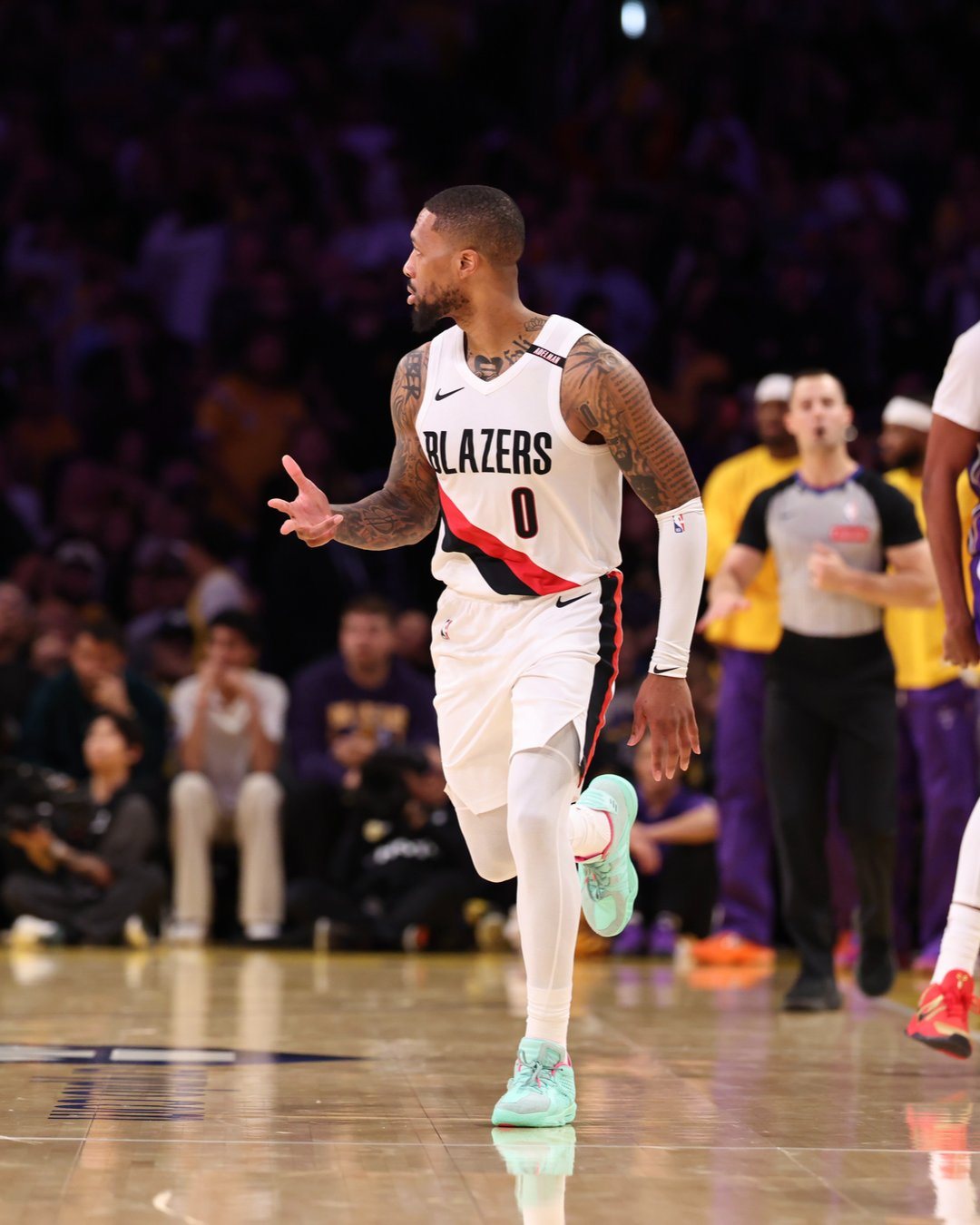 Damian Lillard brings the ball up against the Lakers