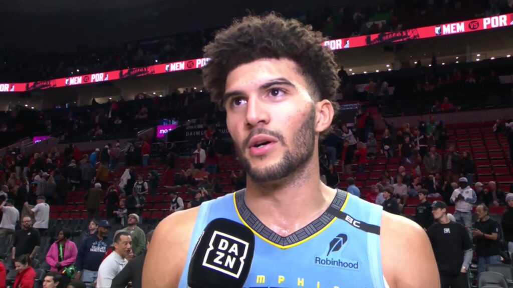 Cameron Boozer in a Grizzlies jersey during an on-court postgame interview in Portland