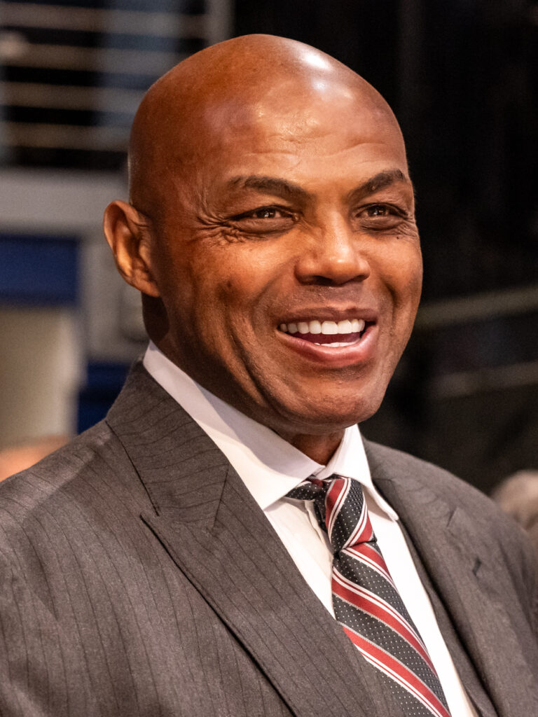 Charles Barkley smiling in a suit in a March 2026 file photograph