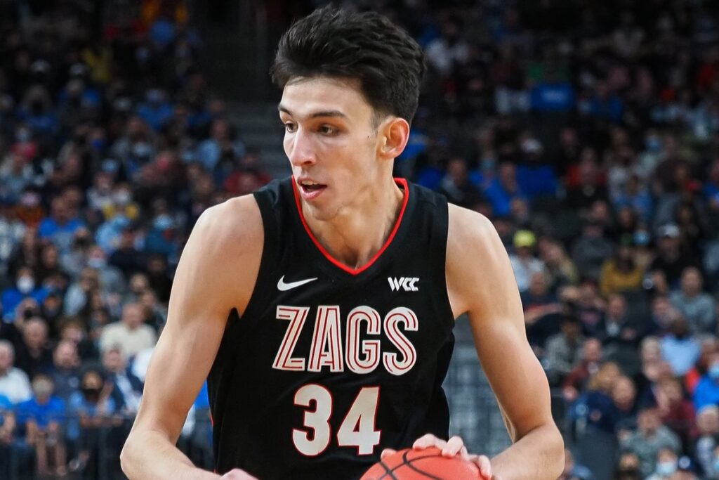 Chet Holmgren in a black Gonzaga jersey dribbling during a college game in Las Vegas