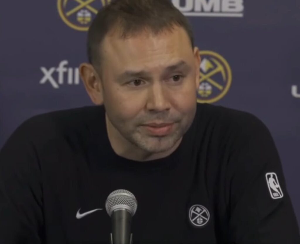 Denver Nuggets head coach David Adelman speaks at a press conference