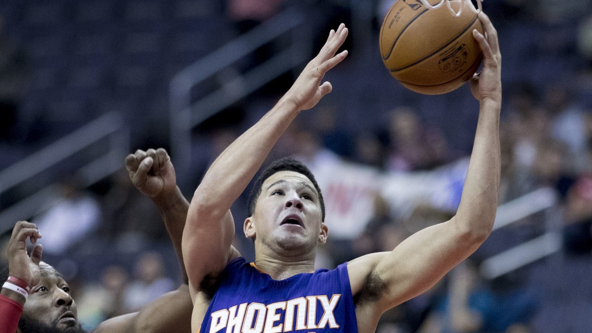 Devin Booker of the Phoenix Suns going up for a layup