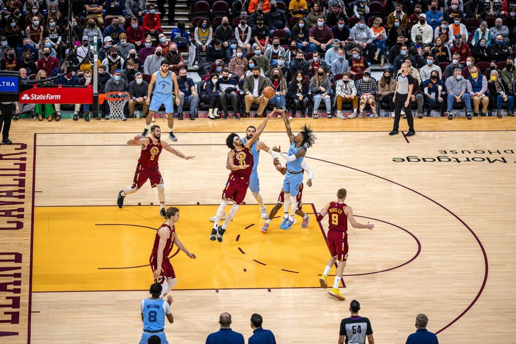 Ja Morant and the Grizzlies at the opening tip against the Cavaliers in Cleveland as a referee watches