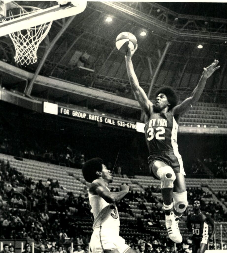 Julius Erving dunking for the New York Nets during an ABA game in 1974