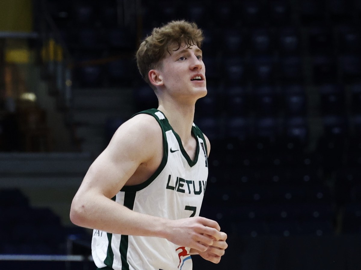 Kasparas Jakučionis in a white Lithuania jersey on the court