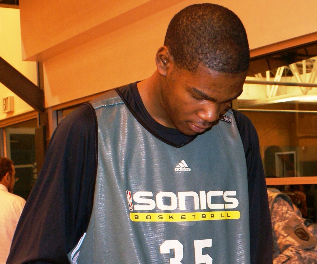 Seattle SuperSonics rookie Kevin Durant signs a basketball at the Sonics practice facility in January 2008