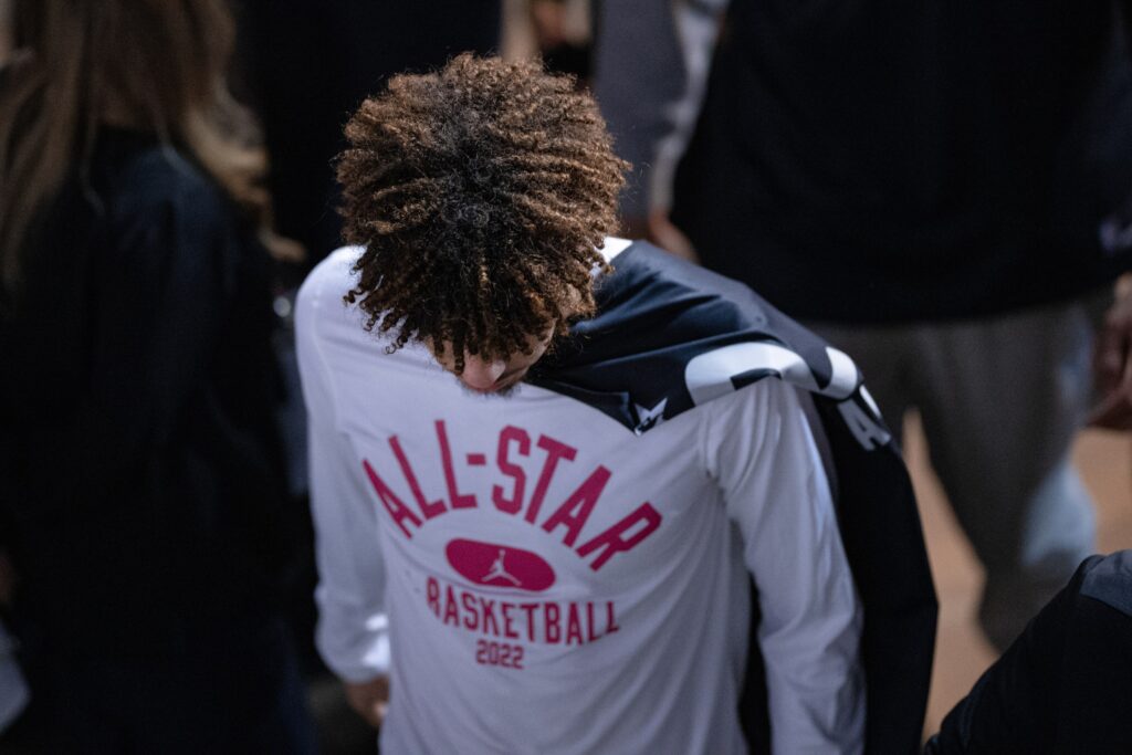 LaMelo Ball in a teal Hornets jersey dribbling during an NBA game