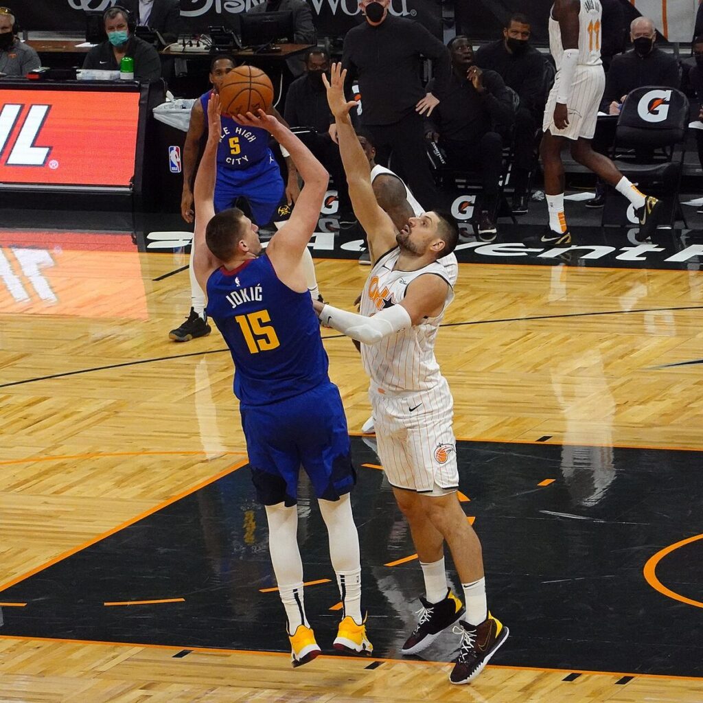 Nikola Jokić shoots a jump shot for the Denver Nuggets