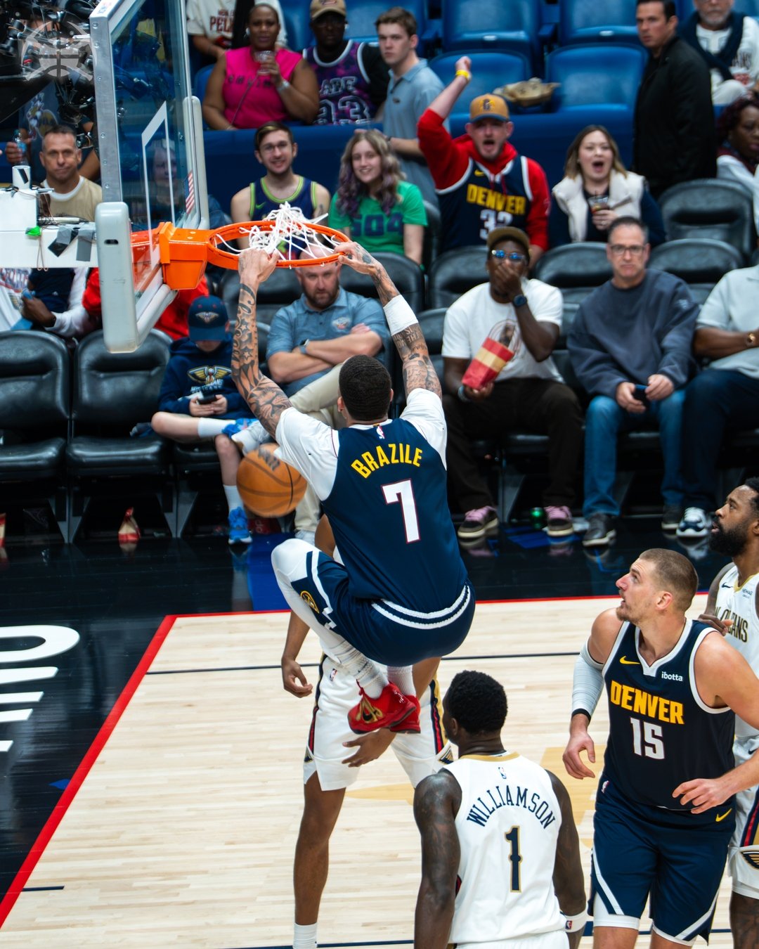 Nikola Jokic watches a dunk