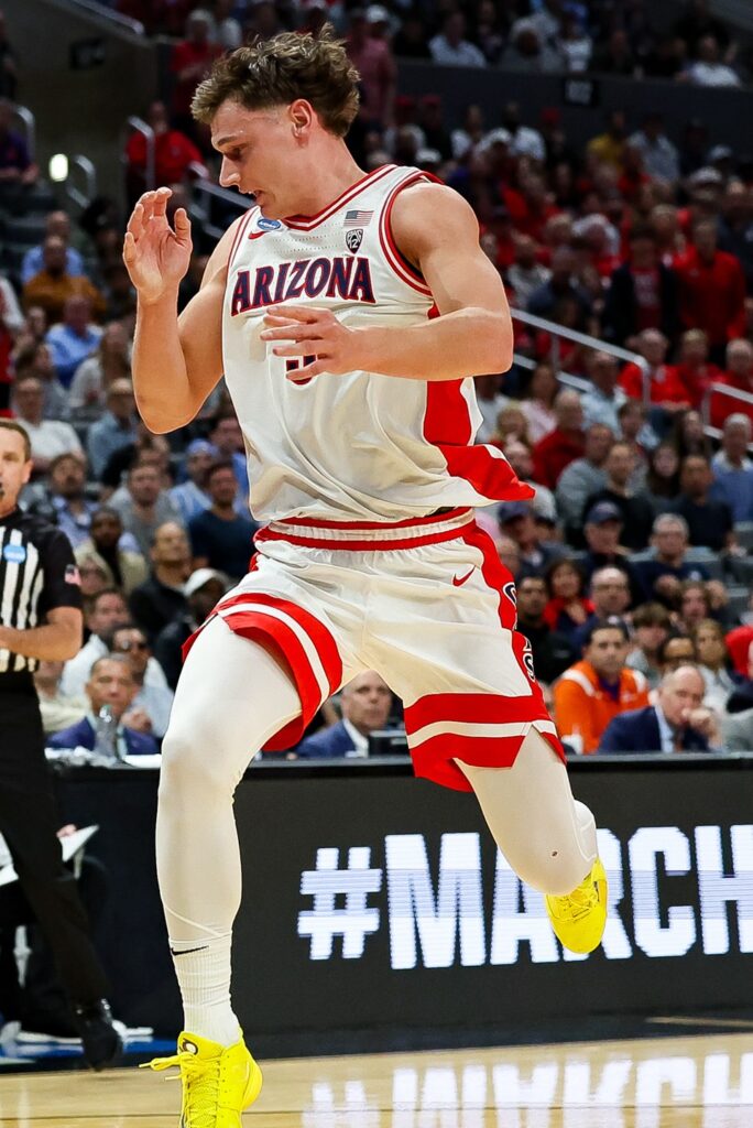 Pelle Larsson in an Arizona Wildcats uniform looking downcourt during a college basketball game