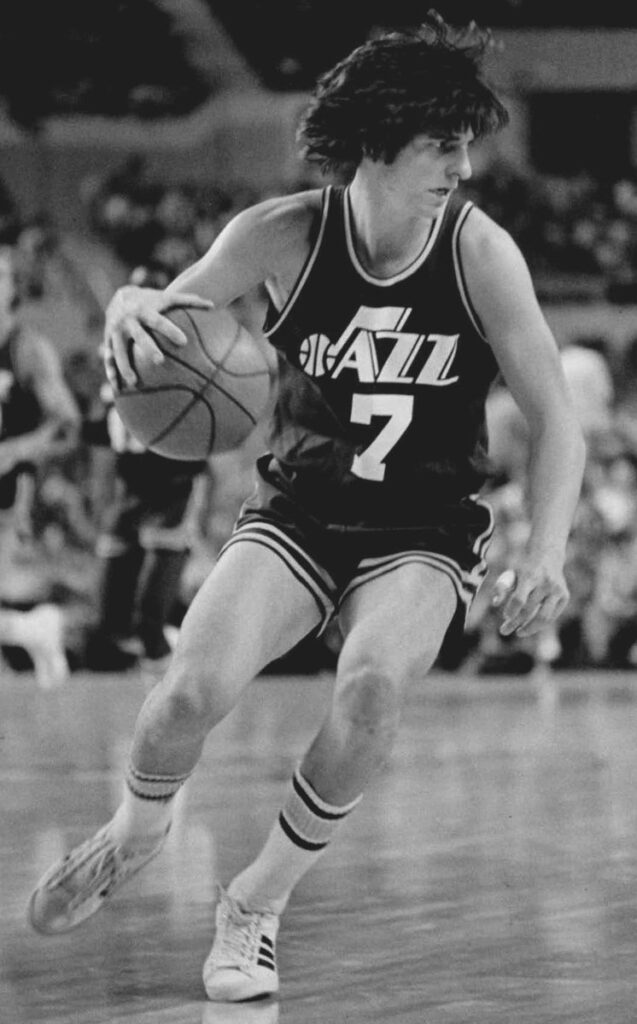 Pete Maravich dribbling in a New Orleans Jazz No. 7 uniform in 1977