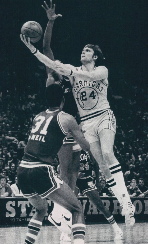 Golden State Warriors forward Rick Barry (No. 24) goes up for a layup, 1976