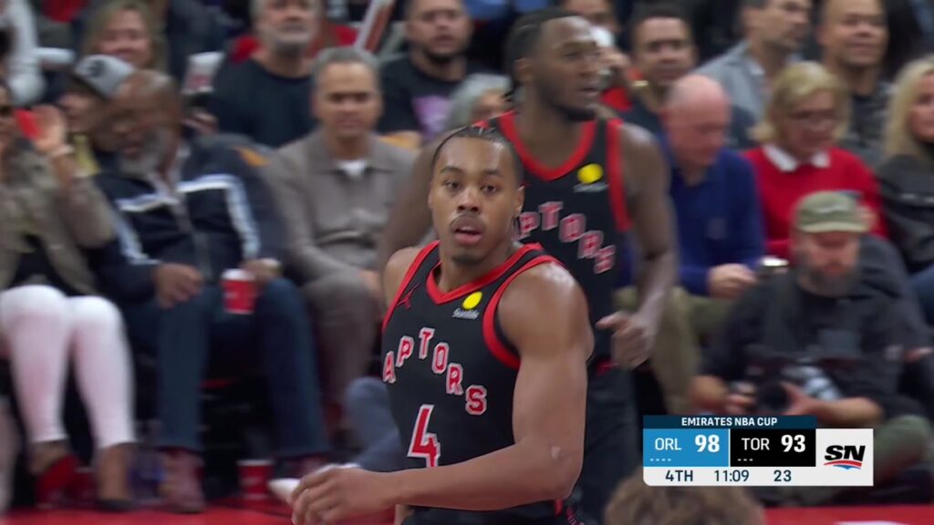 Scottie Barnes, wearing No. 4 for the Raptors, on the court against the Magic in Toronto