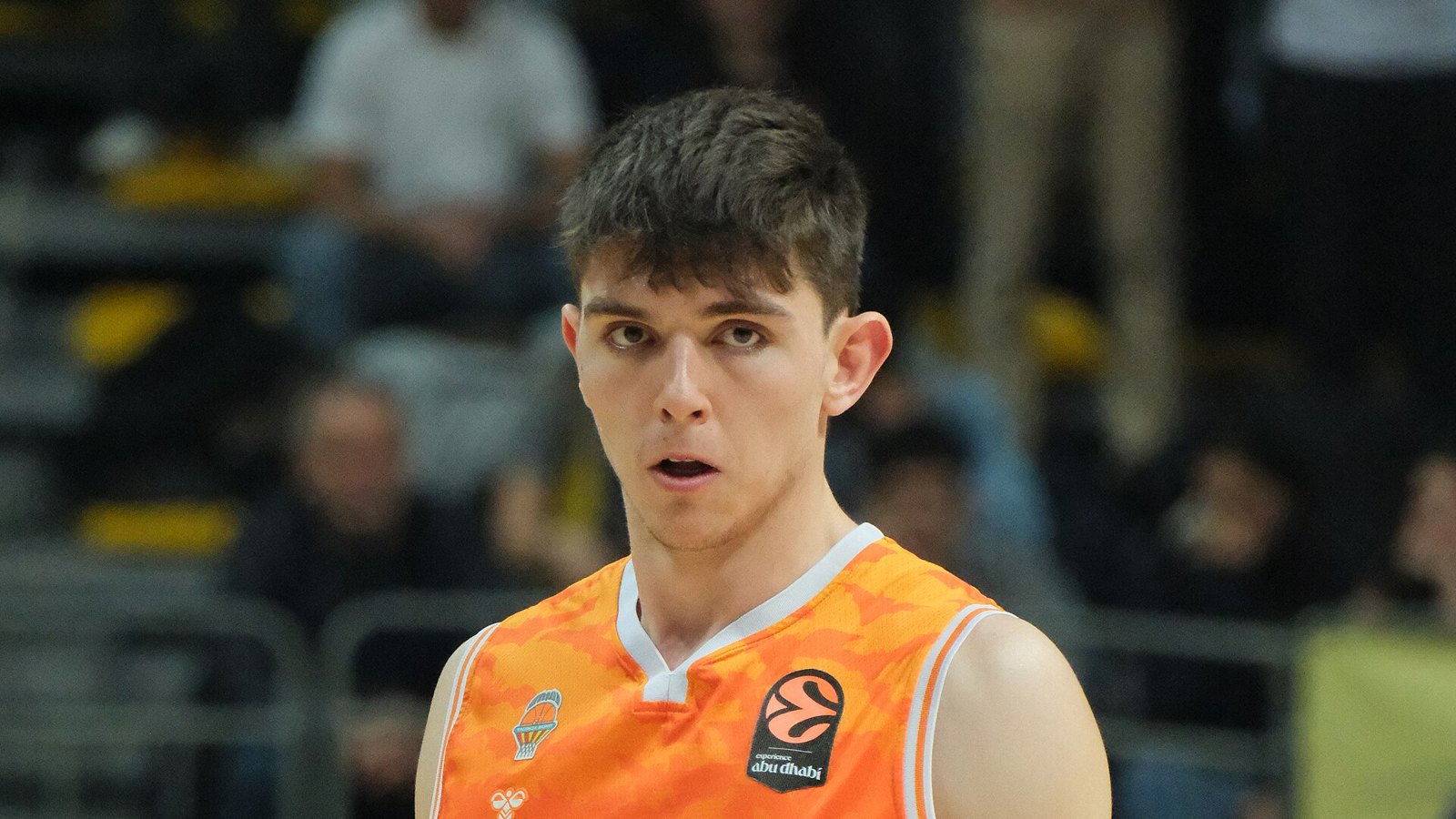 Sergio de Larrea in an orange Valencia Basket uniform during a EuroLeague game in January 2026