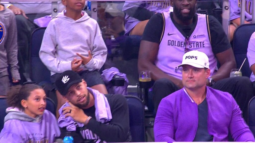 Stephen Curry sitting courtside with his family at Game 2 of the WNBA Finals in San Francisco