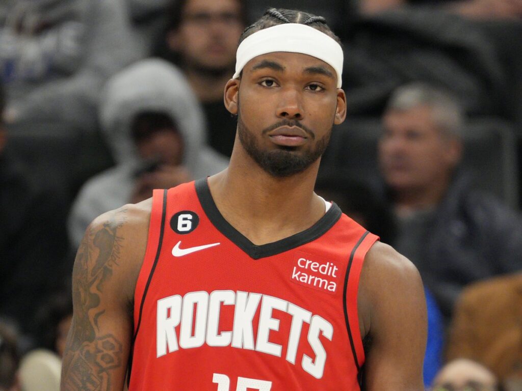 Tari Eason in a red Houston Rockets No. 17 jersey