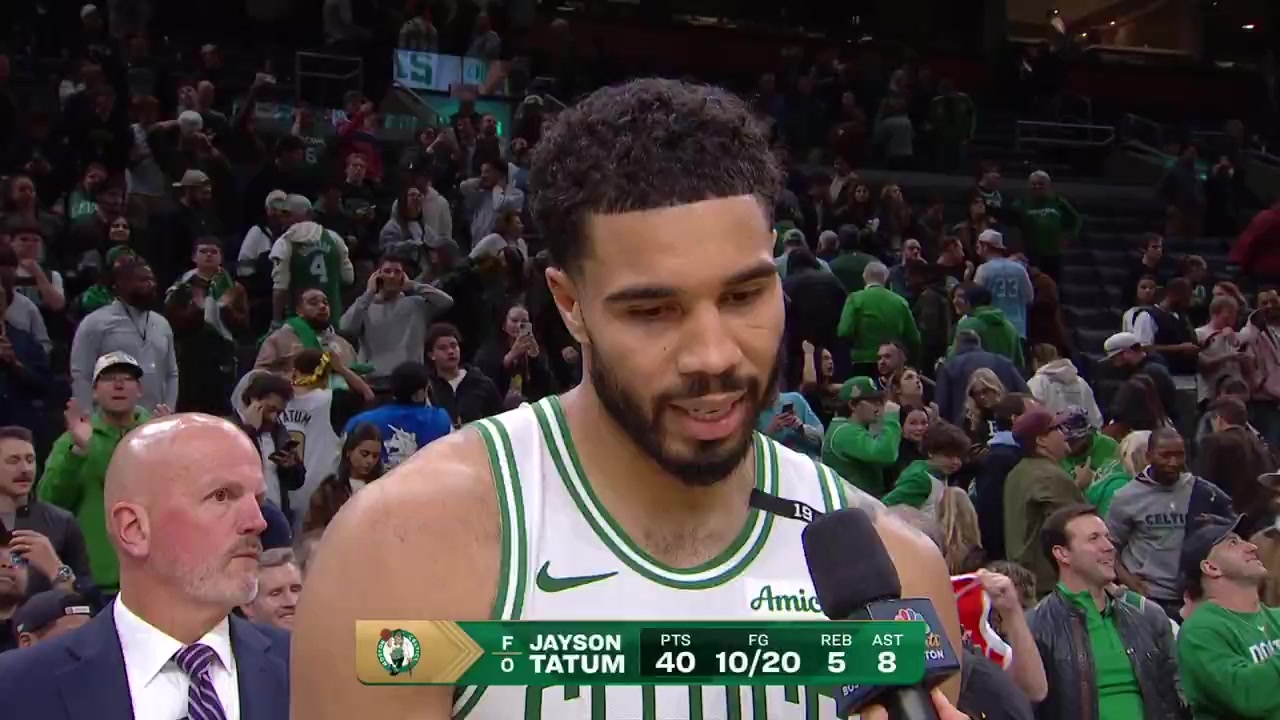 Jayson Tatum speaks on the court at TD Garden after his overtime buzzer-beater against Brooklyn