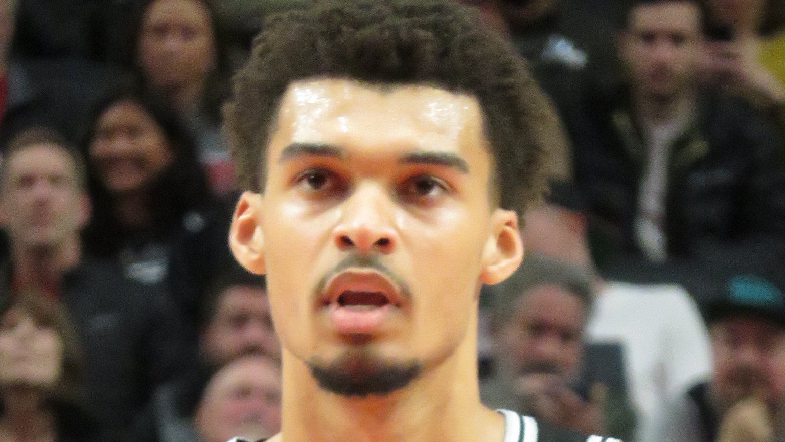 Victor Wembanyama in a black San Antonio Spurs No. 1 jersey during a game
